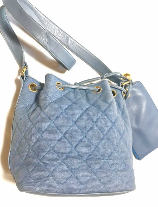 CHANEL Vintage blue quilted canvas and leather combo hobo bucket shoulder bag with drawstrings and golden CC mark balls Supply