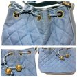 CHANEL Vintage blue quilted canvas and leather combo hobo bucket shoulder bag with drawstrings and golden CC mark balls Supply